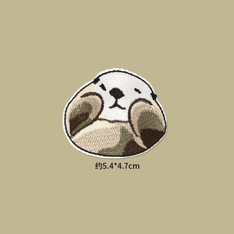 Self Adhesive Patch Stickers featuring an adorable embroidered otter design, perfect for clothes and accessories.