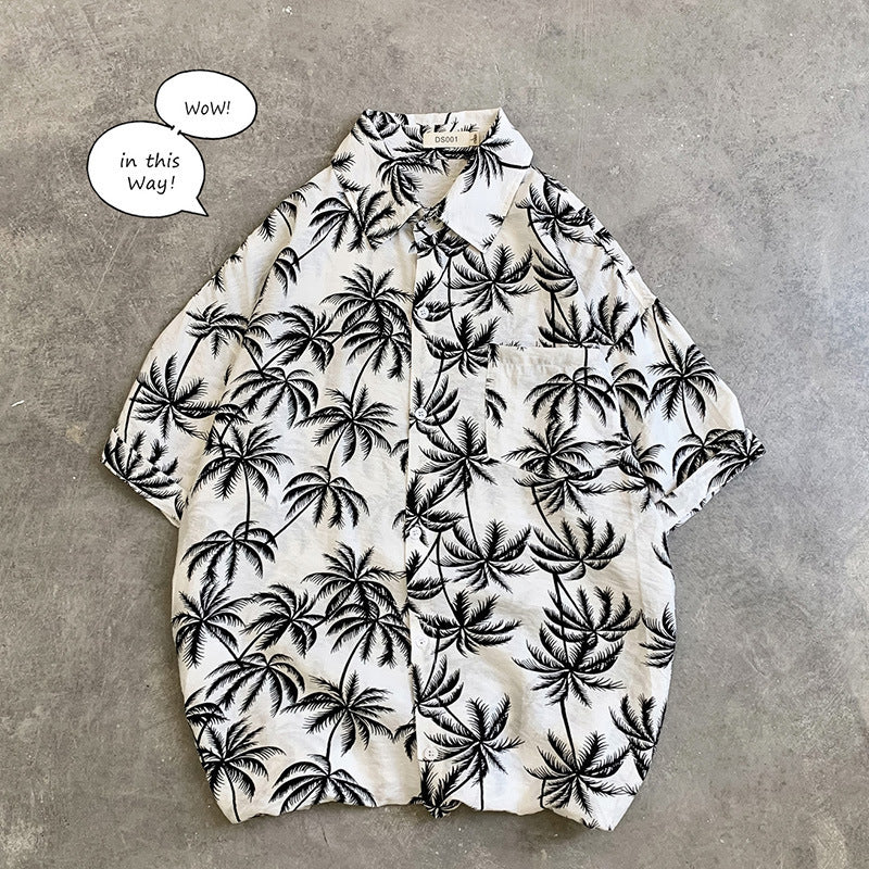Men’s Hawaiian Aloha Shirt featuring a vintage floral beach print with palm trees on a lightweight fabric.