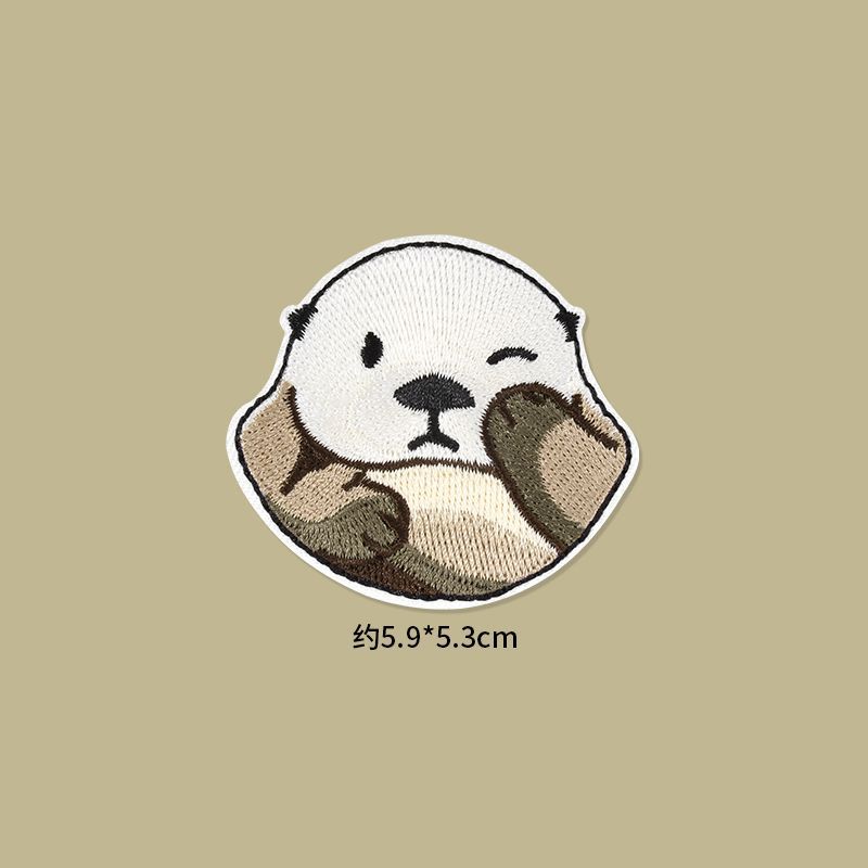 Self Adhesive Patch Stickers featuring a cute embroidered otter design for clothing and accessories.
