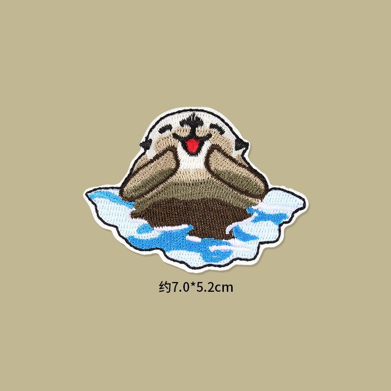 Self Adhesive Patch Stickers featuring a cute otter design on an ice floe, perfect for clothing and accessories.